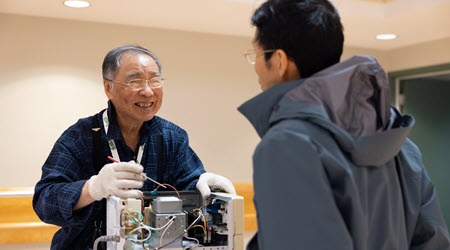 Repair volunteer repairs a small appliance at a Richmond Reuse & Repair Café