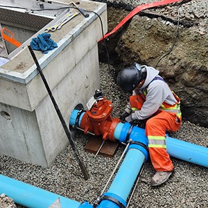 water maintenance working on a pipe