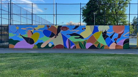 Tennis mural painting on tennis court wall