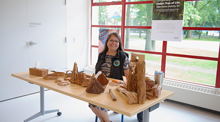 An artist dispaying their weaving at the Richmond Cultural Centre Annex
