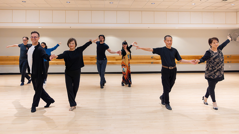 A group of adults taking part in Latin Dance