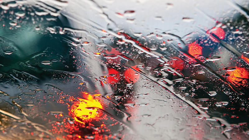 View of heavy rain through a windshield