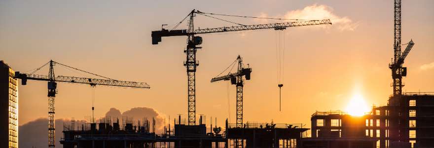 View of cranes and buildings under contstruction