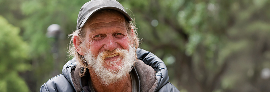 Smiling man in a park setting