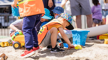 Children playing in the sand in Kidstruction zone