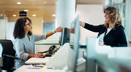 Resident paying utility bill in person.